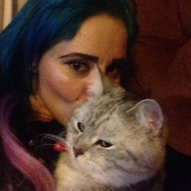 A photo that Denise took of herself and her cat, Enzo.  