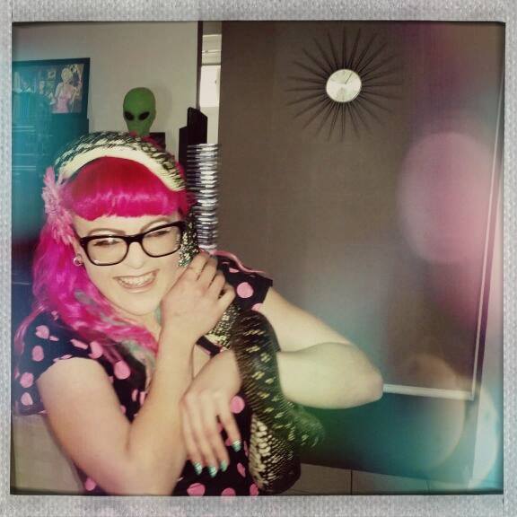 Having my hair re-styled by Monty the Snake.  He is very cheeky!  I'm wearing my pink polkadot VoH halter neck circle dress with matching bolero.  Photo by Kelvin Bitomsky from Vivien of Holloway Australia.  