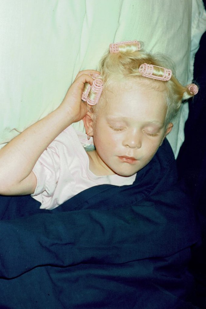 Sleeping with pink curlers in my hair when I was little -photo courtesy of my Mum