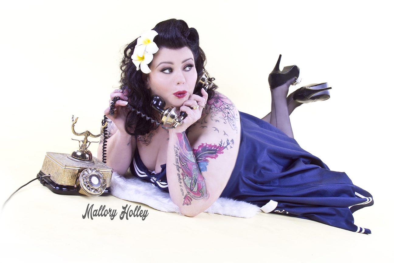 Pinup photoshoot with telephone and motley Hell Bunny dress