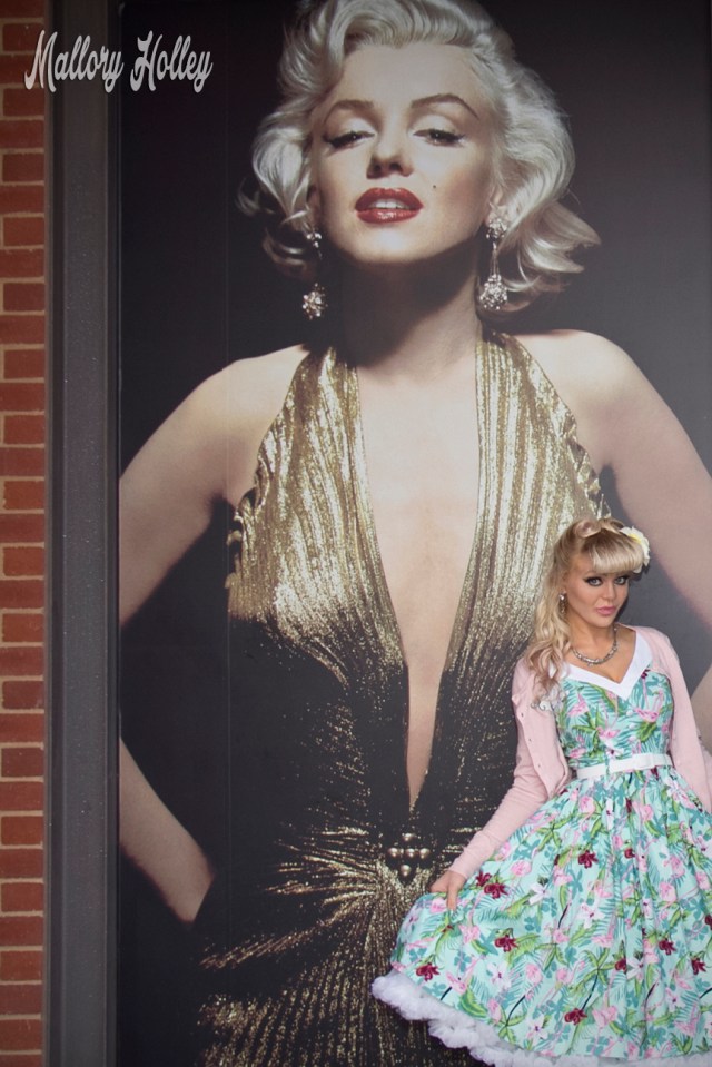 Posing for yet another photo with Marilyn Monroe