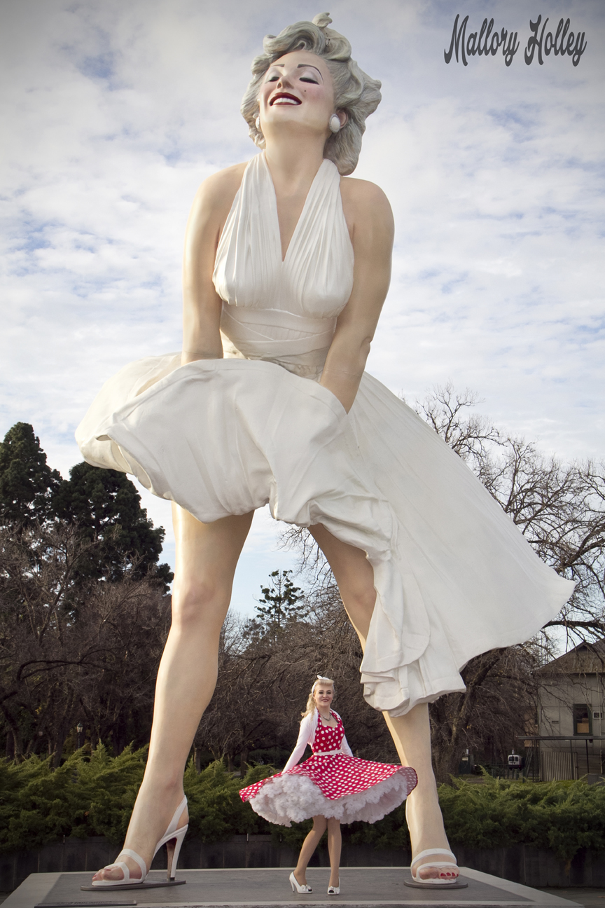 Mallory twirling underneath Forever Marilyn